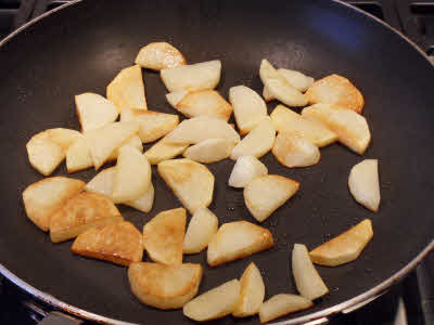 Add potatoes and fry till they are golden brown