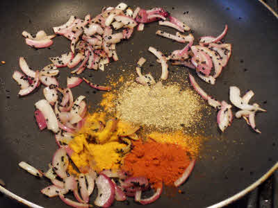 Add turmeric powder, red chillies powder, coriander powder
