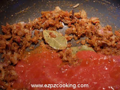 Saute tomatoes for curried kale chane