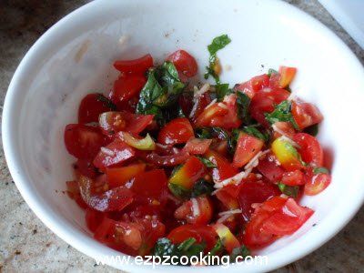 Mix tomatoes, basil, garlic, salt, pepper and oil