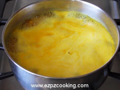 Once the dhuli masoor dal boils, reduce the heat