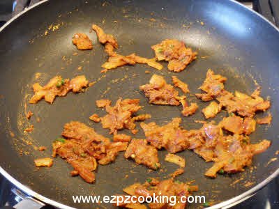 Add tomato puree for fried baingan