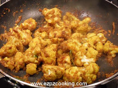 Add fried phoolgobhi to the gravy