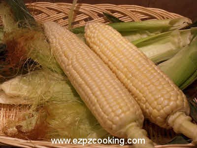 Remove husks from the corn cobs