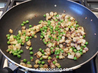 Saute onion potatoes and peas