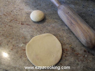 Roll the dough for plain parantha