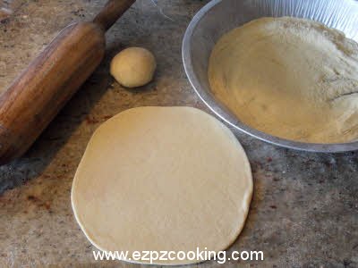 Roll the dough for plain parantha