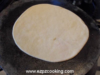 Cook plain parantha