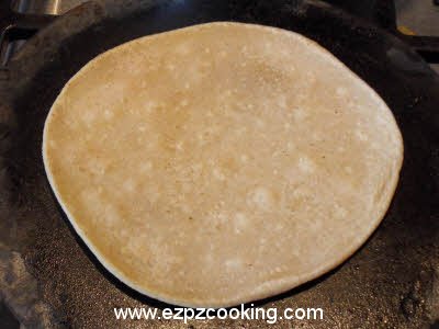 Cook plain parantha