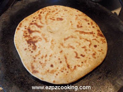 Cook plain parantha