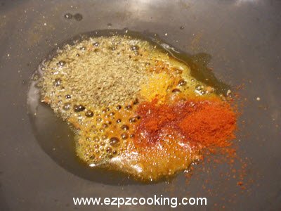 Add turmeric powder, chilli powder, coriander powder