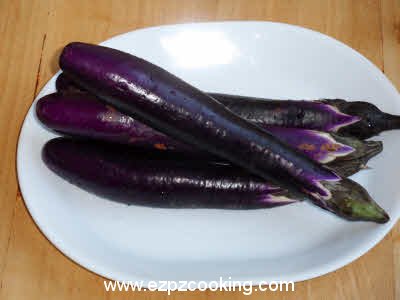 Wash and slit eggplants