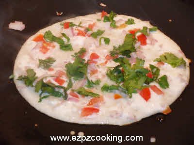 Spread the uttapam batter