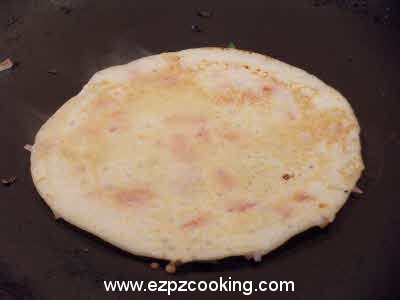 Cook uttapam from both sides