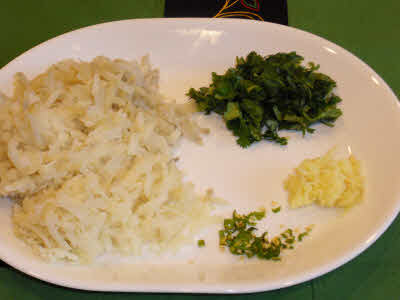 Grate boiled potatoes