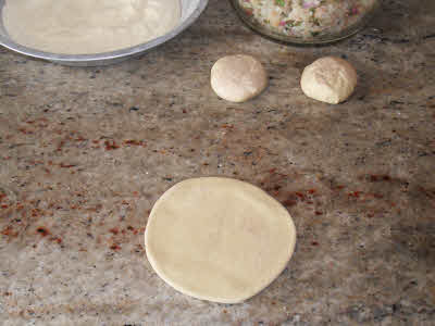 Roll the dough for aloo parantha