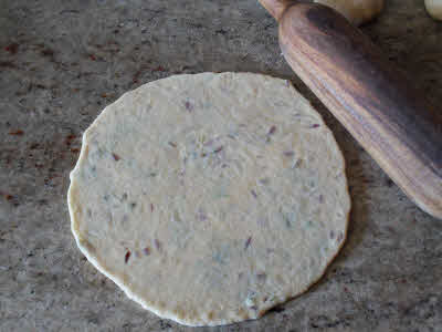 Roll the dough for aloo parantha