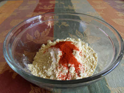 Mix Besan, chili powder, salt, chat masala, asafoetida