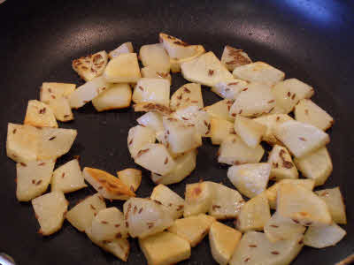 Fry till potatoes are golden brown