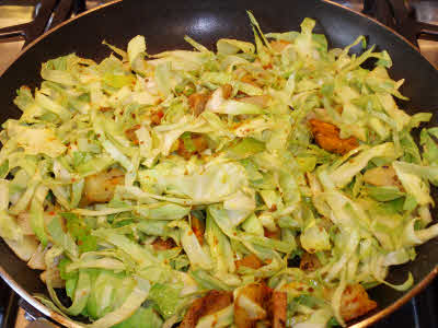 Add rest of the spices and cabbage