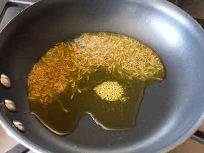 Preparing chaunk for masoor dal