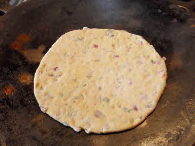 Cook Dal Parantha on one side