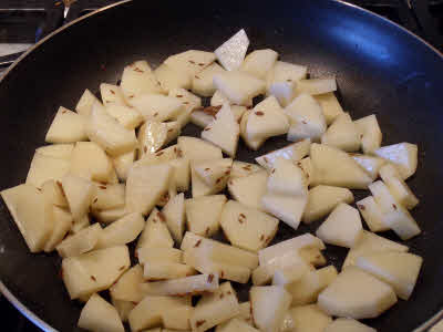 Add potato pieces and stir fry