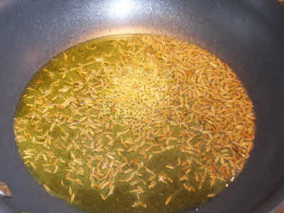 Prepare tempering for Spinach Moong Dal