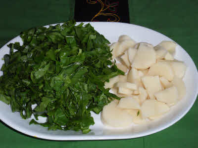 Chop spinach and potatoes