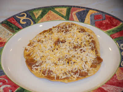 Top the tostada with cheese