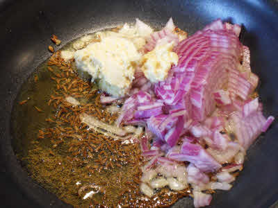 Frying onion and ginger for urad dal