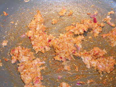 Add spices to onion mixture