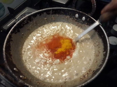 Add haldi, red chilli powder and kari leaves