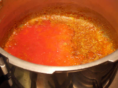 Add pureed tomatoes