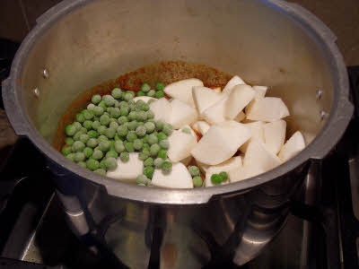 Add shalgam (turnip) pieces, peas and salt