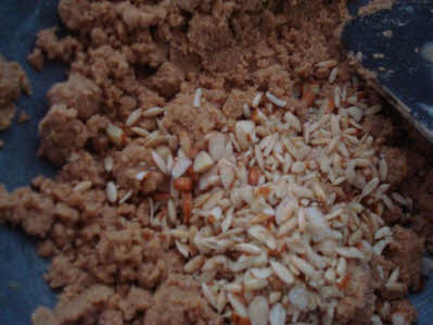 Add melon seeds and almonds to the laddoo mixture