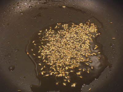 Crackle the cumin for shakarkand aloo chaat