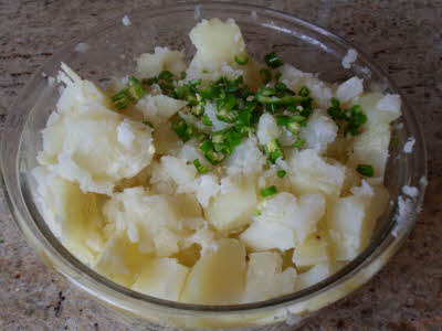 Peel and grate the boiled potatoes