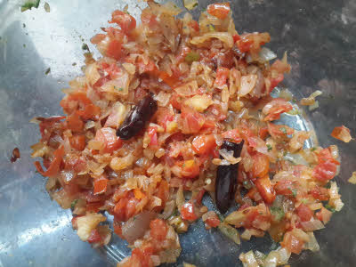Cook onion and tomato