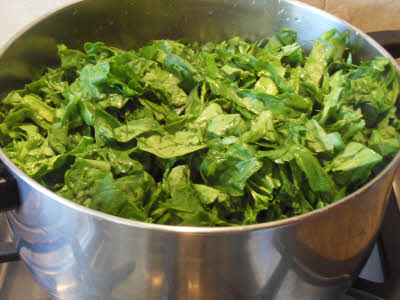 Boil the leaves for sarson ka saag