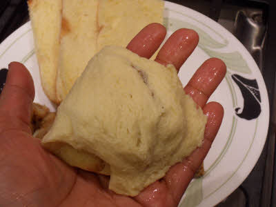 Squeeze the bread to make it into a flattened ball
