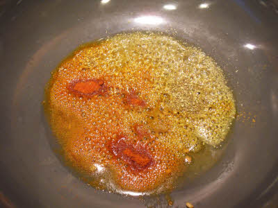 Add turmeric powder, chilli powder, coriander powder