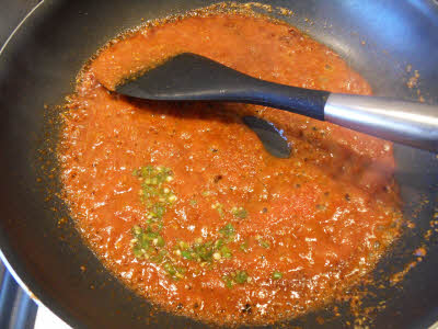 Add pureed tomatoes and green chillies