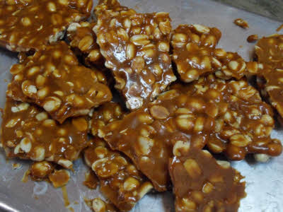 Remove the chikki and break it into bite size pieces