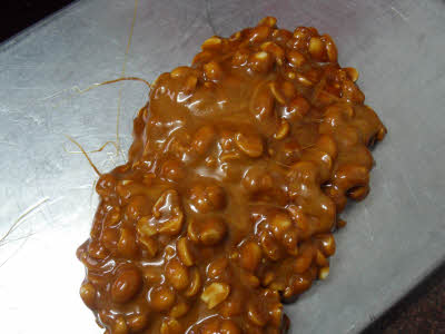 Pour the chikki mixture in a tray