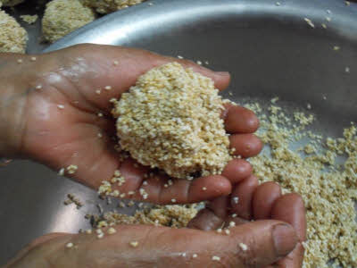 Moisten your hands and make laddu