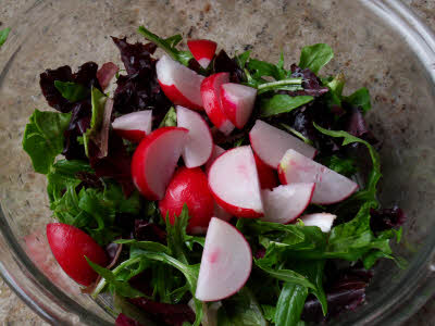 Chop radishes for mandarin salad