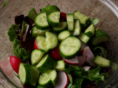 Chop cucumber for mandarin salad