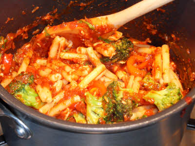 Mix vegetables and pasta in sauce
