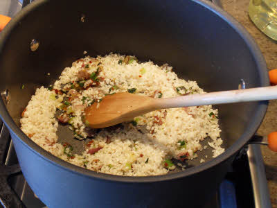 Add rice for vegetable risotto